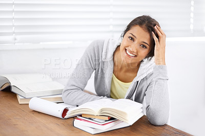 Buy stock photo Portrait, learning and happy woman studying in university, reading and school project at desk. Face, books and smile of young student at table for education, knowledge and notes in college in Brazil