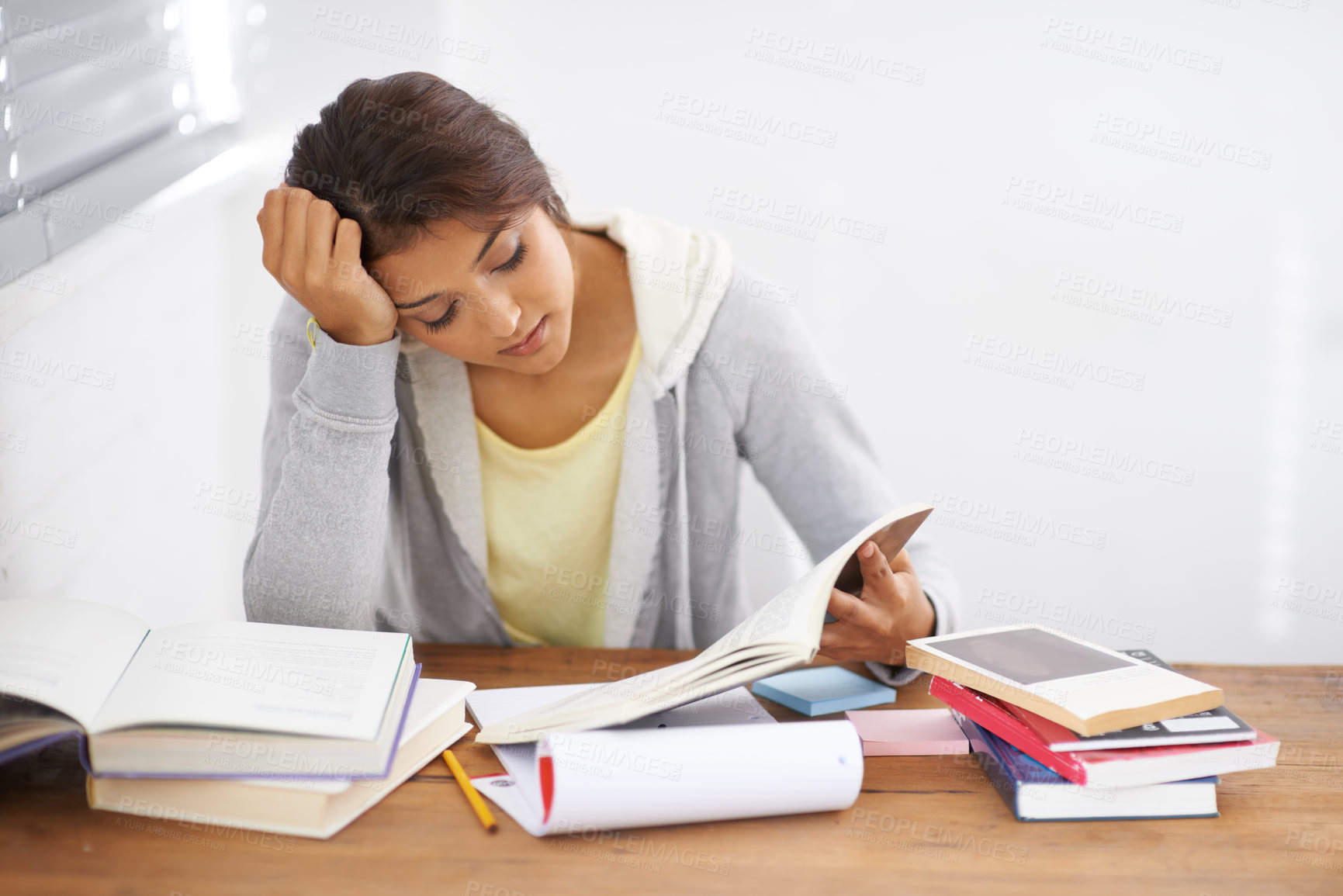 Buy stock photo Student, woman and reading with books for learning, knowledge or education with idea for study in bedroom.
Young person, girl and stress at desk with novel for scholarship, project or assessment test