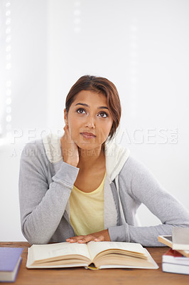 Buy stock photo Student, woman and thinking with books for learning, knowledge or education with idea for study in classroom.
Young person, girl and thoughtful at desk with mockup for scholarship, test or assessment
