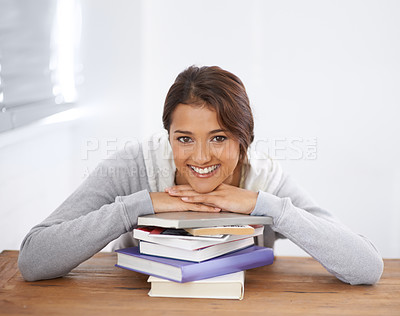Buy stock photo Portrait, books or happy woman learning at table in college, study or reading for school project. Face, leaning on textbook or student at desk, education knowledge or university scholarship in Brazil