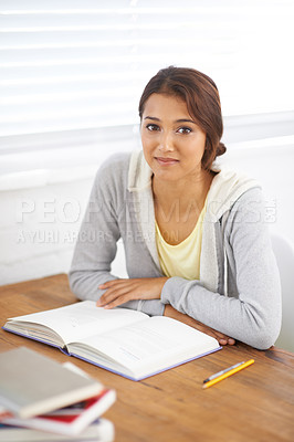Buy stock photo Portrait, book or woman at table in university, study and reading for school project. Face, textbook and young student at desk in college for education, learning or knowledge on scholarship in Brazil