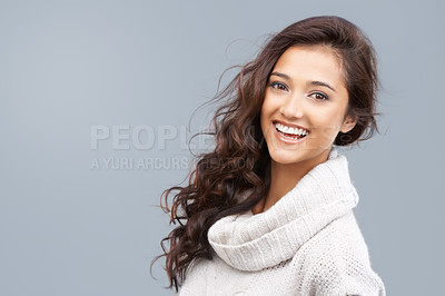 Buy stock photo Pretty woman in winter clothing smiling happily at the camera with copyspace