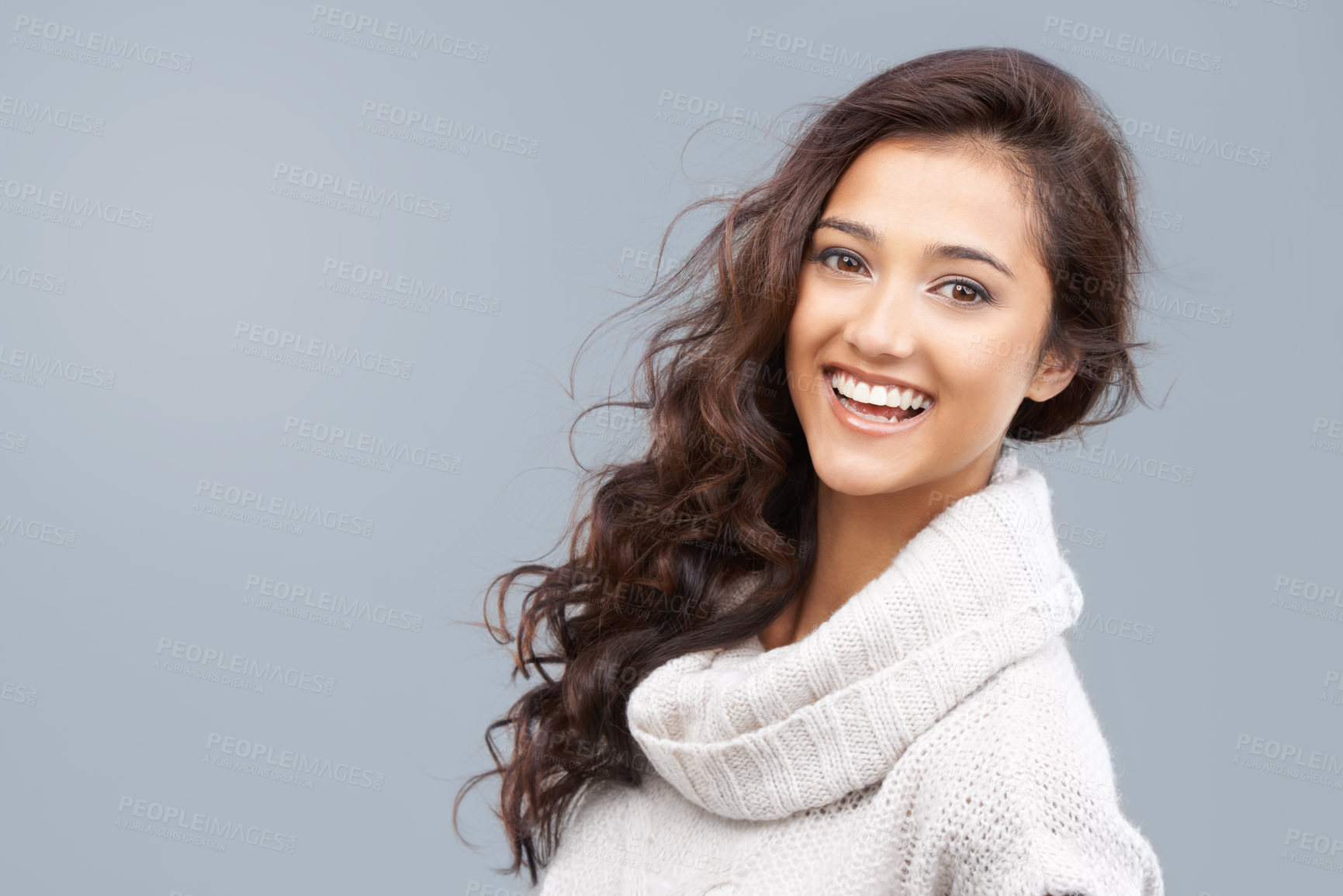 Buy stock photo Pretty woman in winter clothing smiling happily at the camera with copyspace