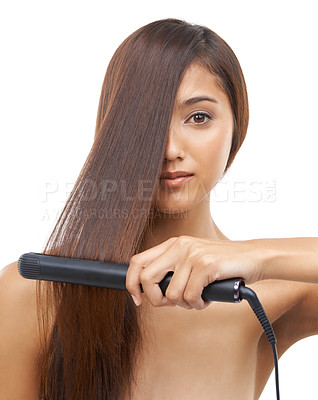 Buy stock photo Hair care, straightener and portrait of woman in studio for cosmetic, salon and beauty treatment. Flat iron tool, confident and young female person with healthy hairstyle routine by white background.