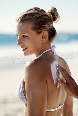 Buy stock photo Sunscreen, back or skin with a woman at beach in summer for protection or skincare outdoor. Female person at sea or ocean for vacation or holiday with spf lotion for dermatology and happiness or care