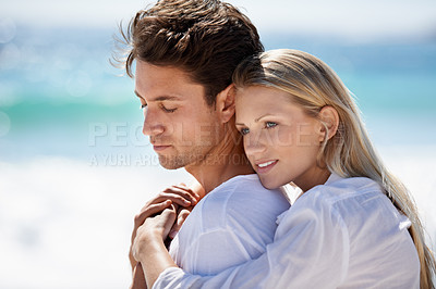 Buy stock photo Happy, couple relax and hug by the beach on travel, vacation and trip date with a smile and embrace. Romance, summer and holiday by the sea and ocean with young people together on a break in Miami