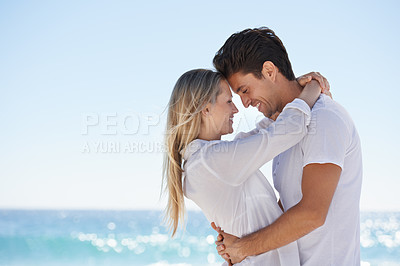 Buy stock photo Couple, beach and hug with love, support and care profile on a date by the sea with romance on vacation. Holiday, ocean and outdoor with summer travel in nature relax on a break and trip with mockup