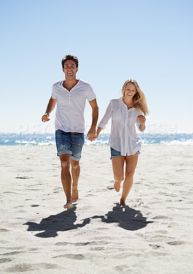 Buy stock photo Love, holding hands and happy couple running on beach for date, outdoor bonding and tropical holiday. Romance, man and woman at sea, fun and relax on vacation together with travel, care and adventure