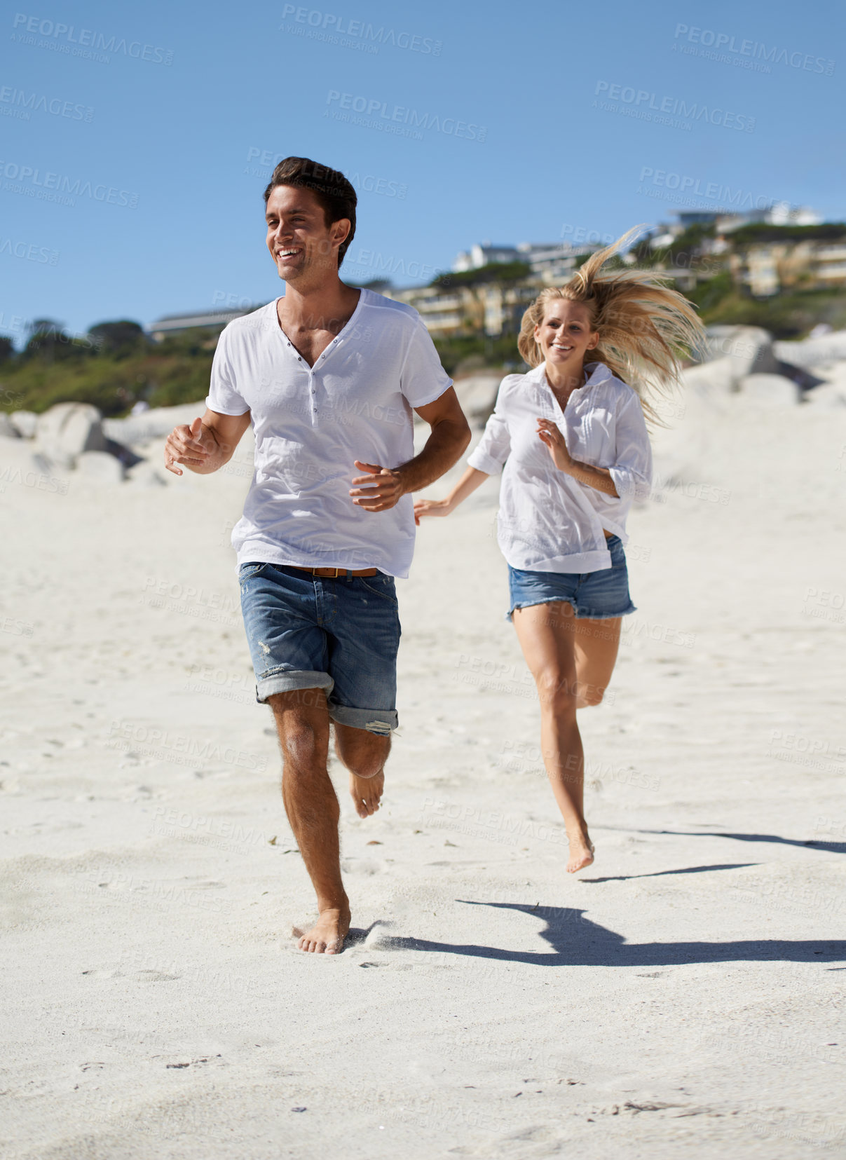 Buy stock photo Couple, running and summer on beach, smile and outdoor in sunshine for vacation, adventure and travel. Man, woman and happy on sand for love, bonding and holiday by sea with exercise in Naples, Italy