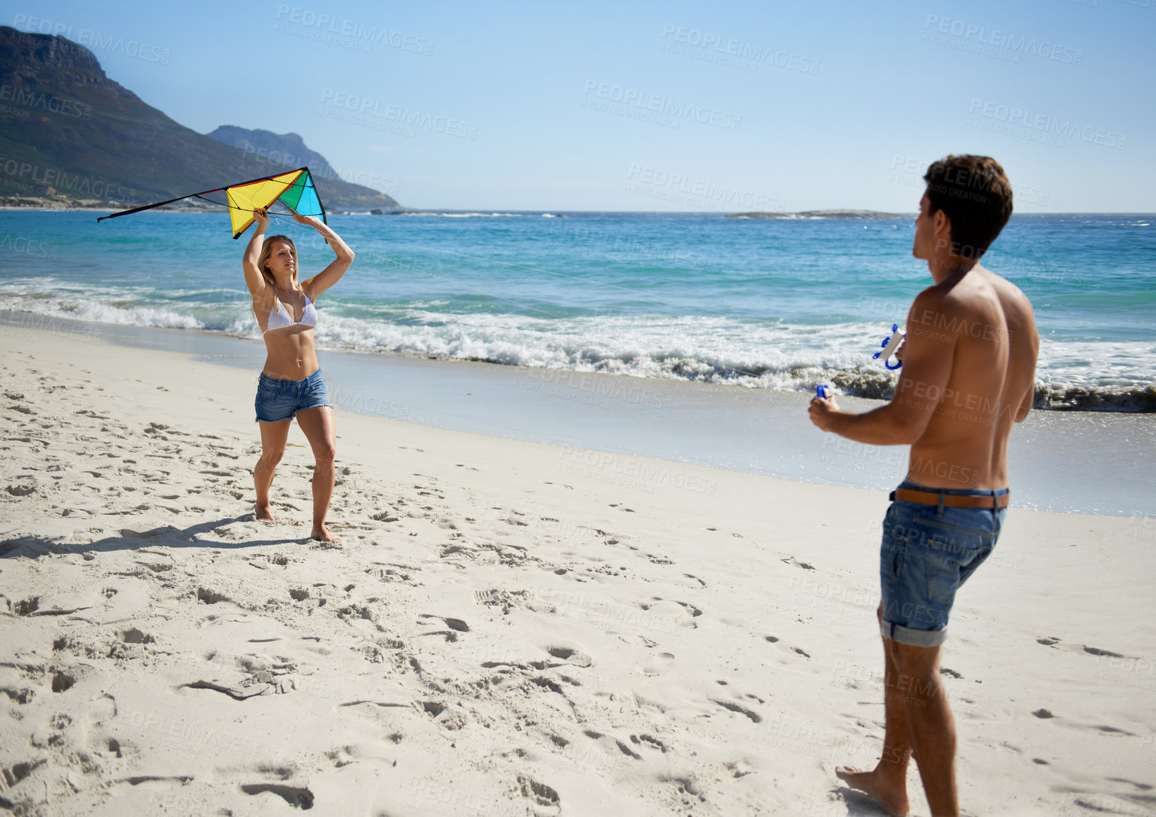 Buy stock photo Couple, kite playing and fun by beach in summer with love, care and support together on a holiday. Happy, vacation and date by the sea in Miami with freedom and travel by the ocean on a trip outdoor