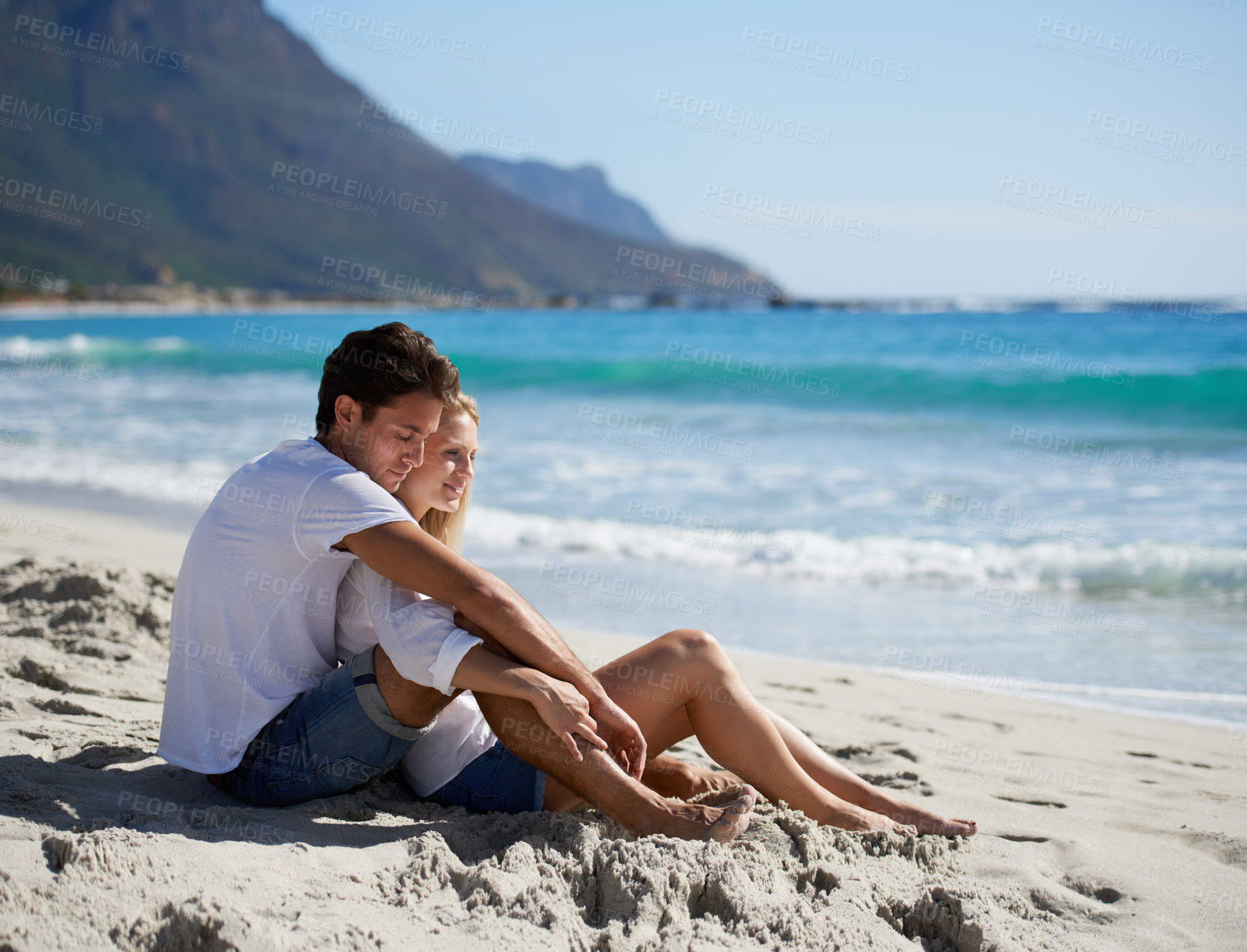 Buy stock photo Love, embrace and couple on beach for date, outdoor bonding and tropical holiday. Romance, happy man and woman at sea, hugging and relax on ocean vacation together with travel, care and adventure.