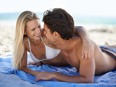 Buy stock photo Beach, couple and embrace with smile, support and care on holiday travel by sea and ocean. Romance, bonding and kiss with young people together on vacation adventure on sand on a date with love