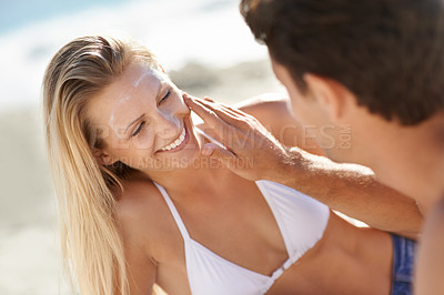 Buy stock photo Beach, couple happiness or apply sunscreen for face care hydration, wellness support lotion or UV protection. Helping happy woman, nature wife or girlfriend suncream application for skin SPF sunblock