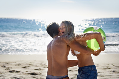Buy stock photo Couple, ball playing and hug by beach in summer with love, care and support together on a holiday. Happy, vacation and date by the sea in Miami with freedom and travel by the ocean on a trip outdoor