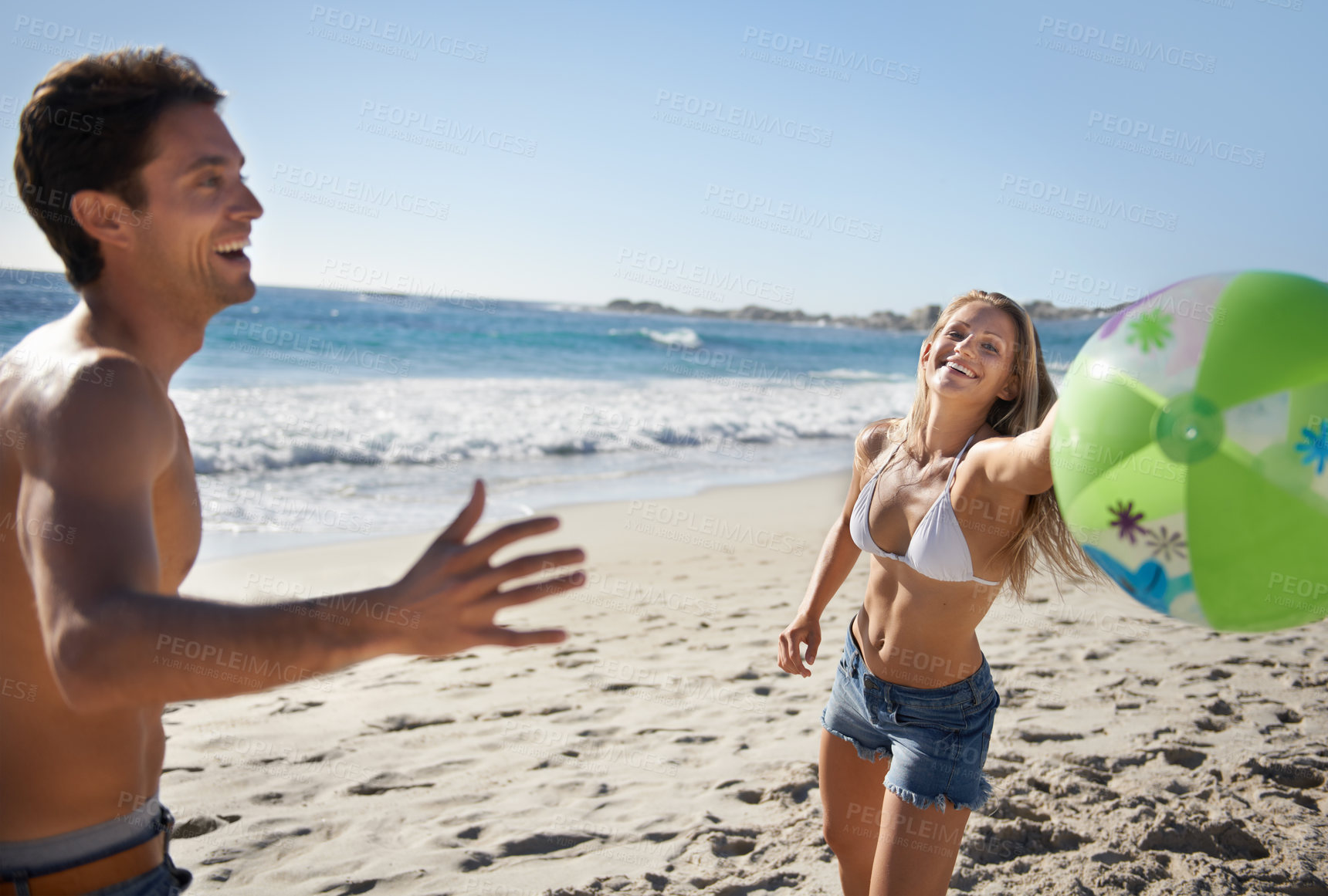 Buy stock photo Couple, ball and fun with laughing by beach in summer with love, care and support together on a holiday. Happy, vacation and date by the sea in Miami with freedom and travel by the ocean on a trip