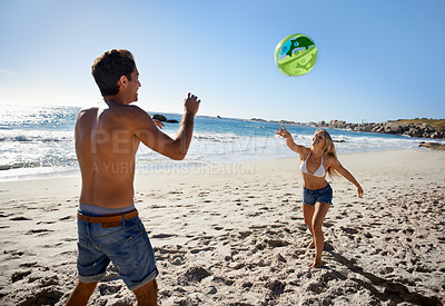 Buy stock photo Couple, ball playing and fun by beach in summer with love, care and support together on a holiday. Happy, vacation and date by the sea in Miami with freedom and travel by the ocean on a trip outdoor