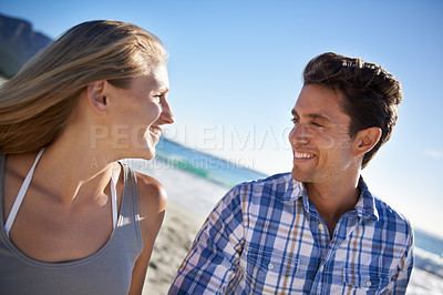 Buy stock photo Couple, walk and smile on beach, talk and outdoor in summer sunshine for vacation, thinking or travel. Man, woman and happy with love, bonding and holiday by ocean for adventure in Naples, Italy
