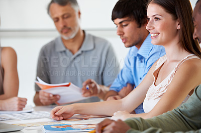 Buy stock photo Team, creative business people and happy woman planning at desk in meeting, brainstorming strategy or thinking of idea in startup office. Group, designers at table or collaboration for photography