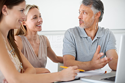 Buy stock photo People, laptop and boardroom discussion with man for planning, strategy or ideas with news team. Women, mature employee and editor by computer for story, newspaper or online magazine in modern office