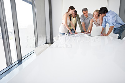 Buy stock photo A group of business people sitting around a boardroom table