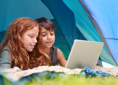 Buy stock photo Children, family and happy with laptop in tent for camping, social media and online movie with watching in nature. Friends, face and kids with smile outdoor on grass for gaming, relax and holiday fun