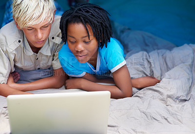 Buy stock photo Children, relax and watch laptop on bed together with cartoon, movie or online games on holiday or vacation. Kids, smile and playing with computer on website, streaming or search on internet