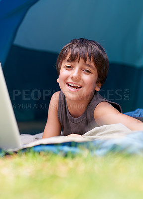 Buy stock photo Boy, happy child in portrait and camping, relax in tent and summer vacation with travel outdoor. Rest on sleeping bag, young kid with smile and adventure in nature, childhood and recreation for fun