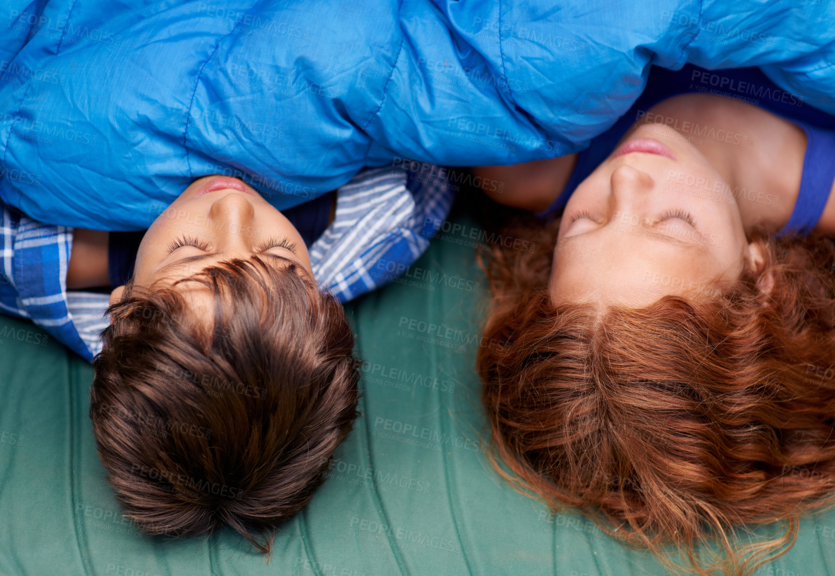 Buy stock photo Two young siblings sleeping inside their tent