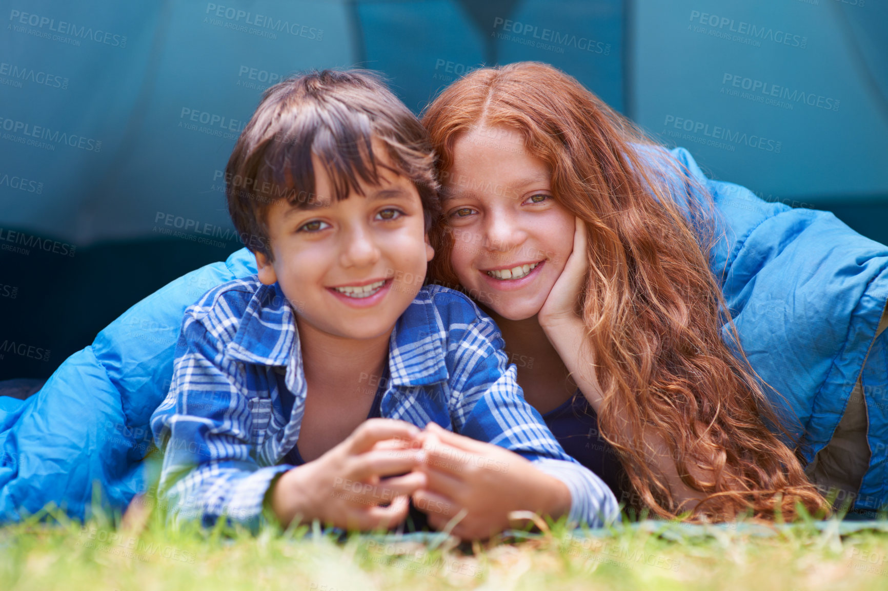 Buy stock photo Portrait, love and children lying with blanket for camping, comfort and bonding outdoor together. Happy family, face and kids outside for journey, fun and adventure in a forest for vacation sleepover