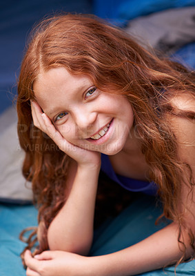 Buy stock photo Tent, camping and portrait of child in sleeping bag for resting, relax and comfortable. Travel gear, youth and happy ginger girl in sleep sack for adventure on holiday, vacation and weekend outdoors
