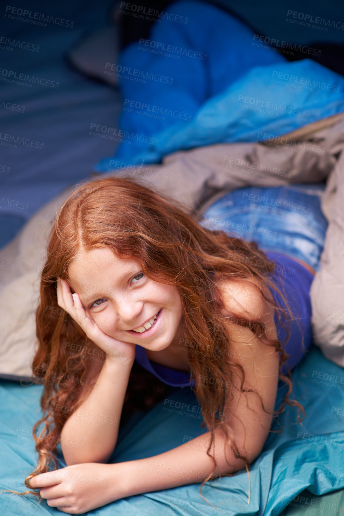 Buy stock photo Portrait of a happy young girl lying in her tent while camping