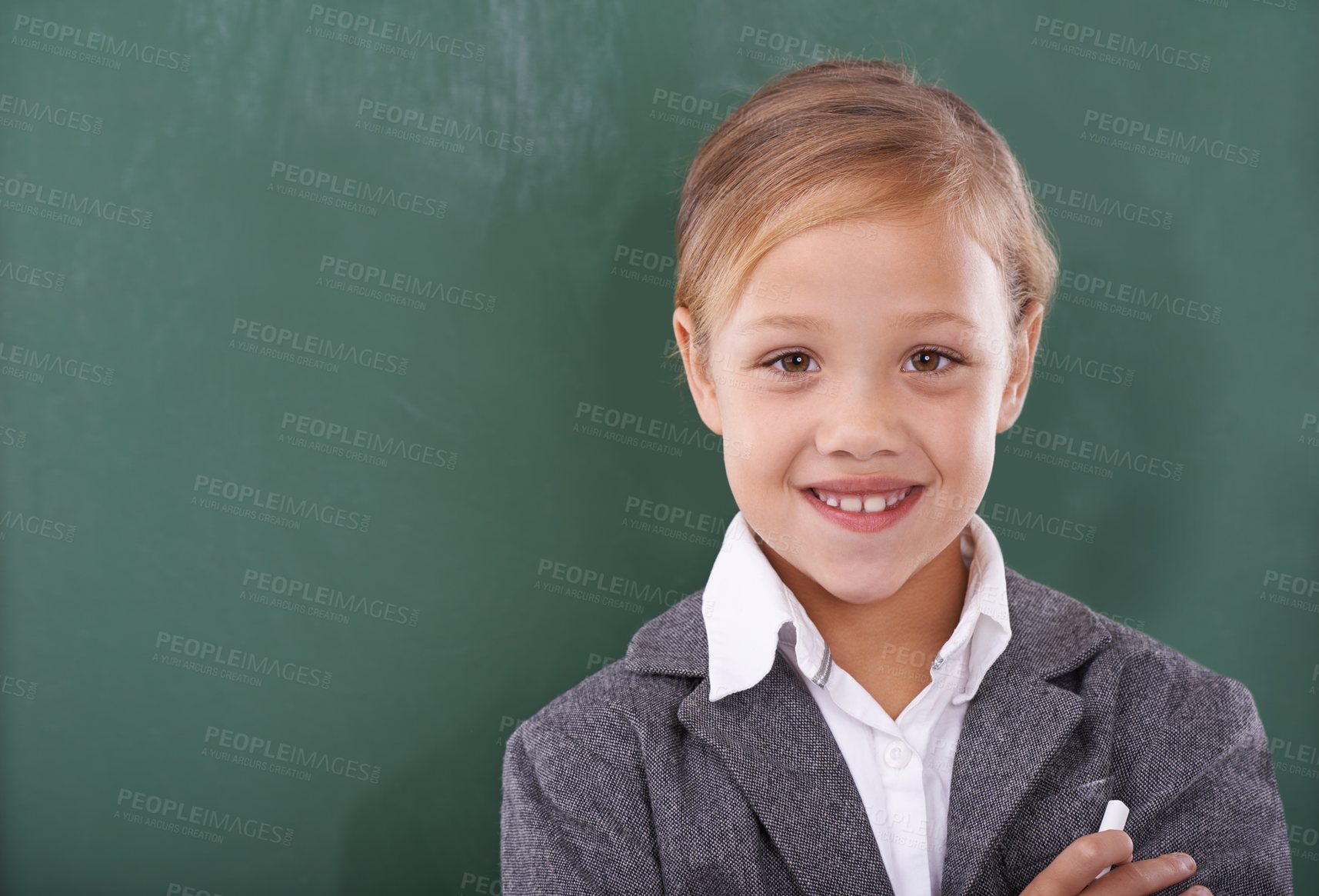 Buy stock photo Child, portrait and chalkboard for school education in classroom for learning, writing or homework. Female person, uniform and kindergarten development or brainstorming or knowledge, study or mockup