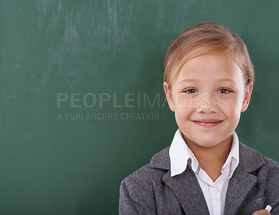 Buy stock photo Child, portrait and chalkboard for school learning in classroom for education, writing or homework. Female person, uniform and kindergarten development or brainstorming or knowledge, growth or mockup