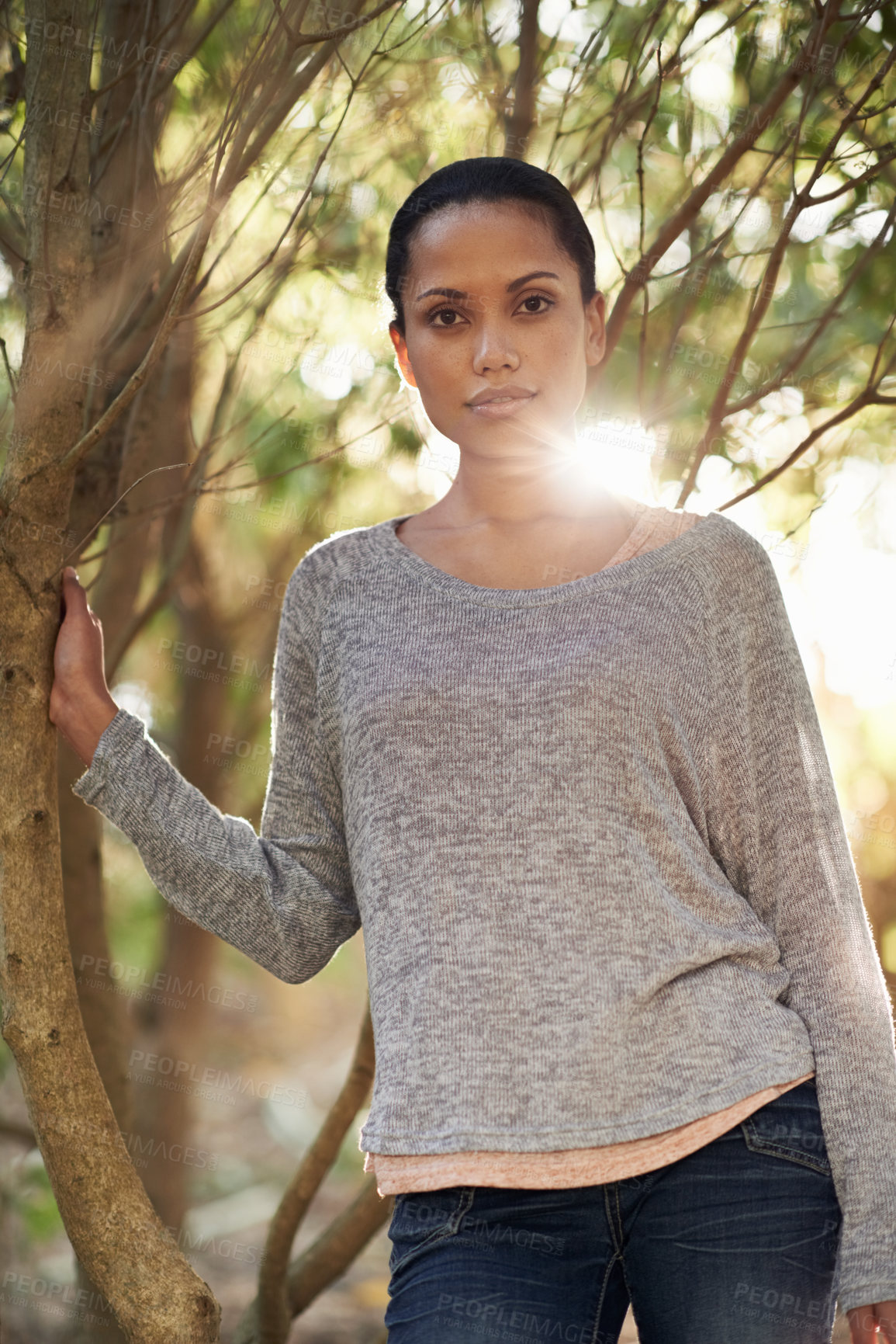 Buy stock photo A young woman enjoying a walk in the woods