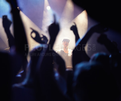 Buy stock photo Concert, audience and dj music with hands from people at rock, band and festival event at a stage with lights. Night show, dance and party with crowd with rave, techno and entertainment at venue