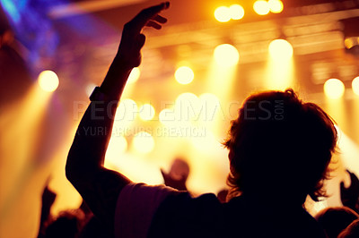 Buy stock photo Night, club and man dance at concert, event or music festival with stage lights and silhouette. Dark, nightclub and person in audience, crowd and social celebration at techno rave with energy