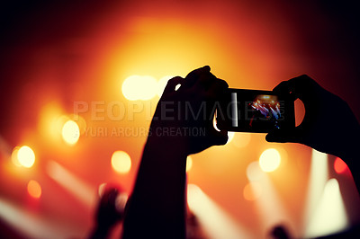 Buy stock photo Hands, smartphone or image of band at concert, music event or audience with light in bokeh. Person, photography or picture on cellphone, technology or celebration with crowd at disco performance