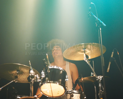 Buy stock photo Man, drums and playing at concert in band for performance, show or party event at night. Male person, drummer or performer musician on base instrument for rock festival, audience or crowd of fans