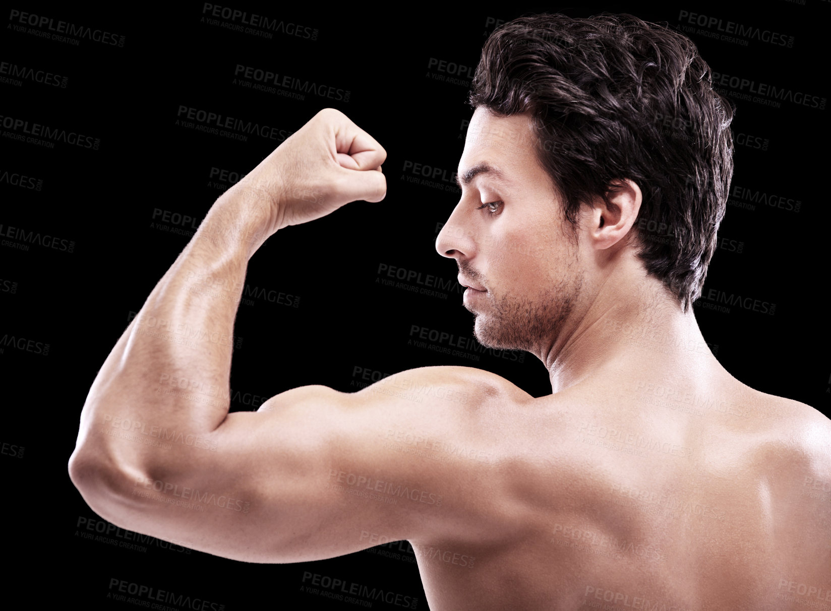 Buy stock photo Back of man, bodybuilder and bicep flex in studio, black background and exercise for power. Strong, sexy and topless male model, sports athlete and arm muscle for pride, training and fitness results