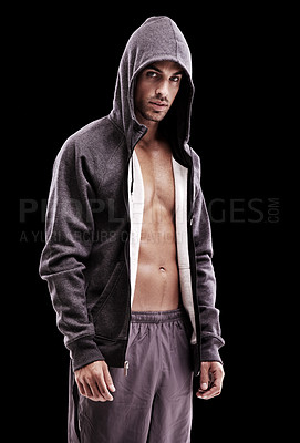 Buy stock photo Studio shot of a brooding bare-chested young man wearing a hoodie