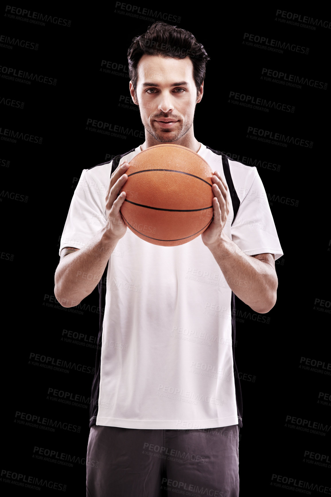 Buy stock photo Basketball, portrait and fitness man with ball in studio for training, wellness or exercise challenge on black background. Workout, face and male athlete with handball, catch or performance match