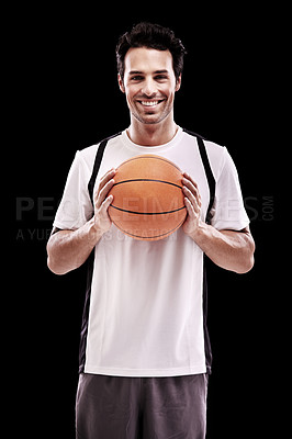 Buy stock photo Studio shot of a handsome young basketball player isolated on black