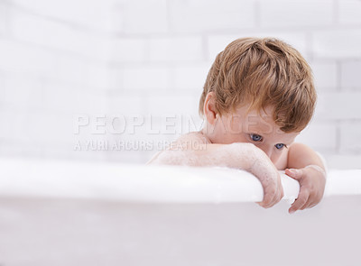 Buy stock photo Baby, bath and washing with bubbles and thinking in the bathroom at home for hygiene. Grooming, brunette and boy child cleaning for bodycare in the house while curious for development and growth