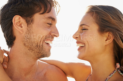 Buy stock photo Beach, love and happy couple hug outdoor with support, trust and care while bonding in nature together. Face, smile and people with gratitude, fun or enjoying relationship, moment or romance