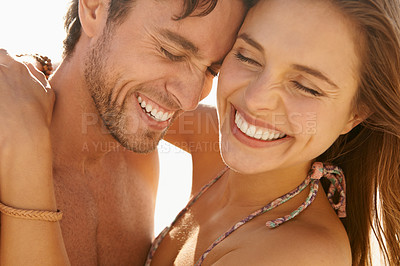 Buy stock photo Couple, happy and holiday with hug, love and care together in the sun on vacation outdoor. Relax, smile and date by a beach with summer travel with funny joke and laughing with romance on a trip