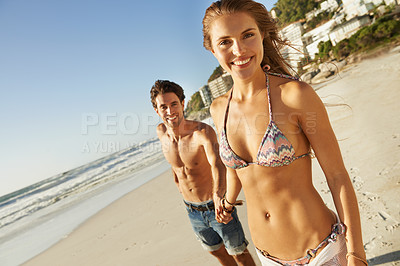 Buy stock photo Couple, holding hands and bikini by ocean, portrait and smile with love, bonding and kindness on vacation. Man, woman and happy on adventure, holiday and outdoor by beach, water and waves in summer