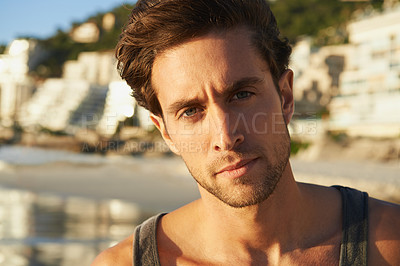 Buy stock photo Man, portrait and relaxed at beach on vacation, confidence and tourist at sea on summer holiday. Male person, face and outdoor adventure in Cape Town, calming ocean and peaceful environment in nature