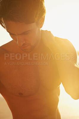 Buy stock photo Man, shirtless and travel to beach at sunset, confidence and tourist at sea on summer holiday. Male person, topless and outdoor adventure for fun, calm ocean and peaceful environment in nature