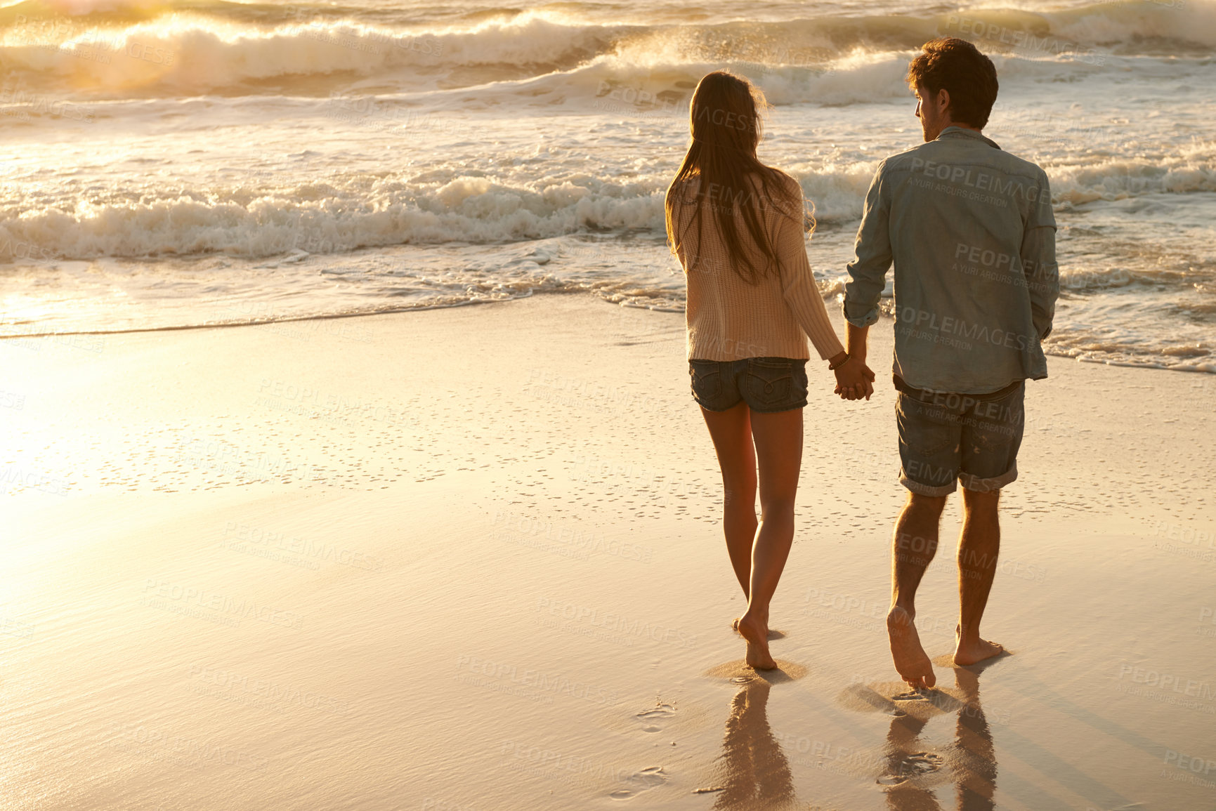 Buy stock photo Beach sunset, love and couple holding hands on walk, sand journey or travel holiday for outdoor wellness in Peru. Mockup space, sea waves and back of man, woman or people on romantic tropical island