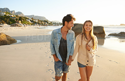 Buy stock photo Couple, holding hands and walking at beach, portrait and smile with love, bonding and kindness on vacation. Man, woman and happy on adventure, holiday and outdoor by sea, water and sand in summer